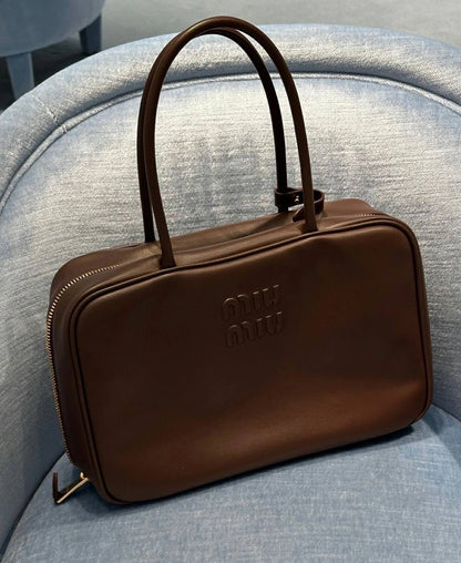 Miu Miu
good quality, 
size 34 *23 cm 
95 dhs✅

Zain12
♥️♥️♥️