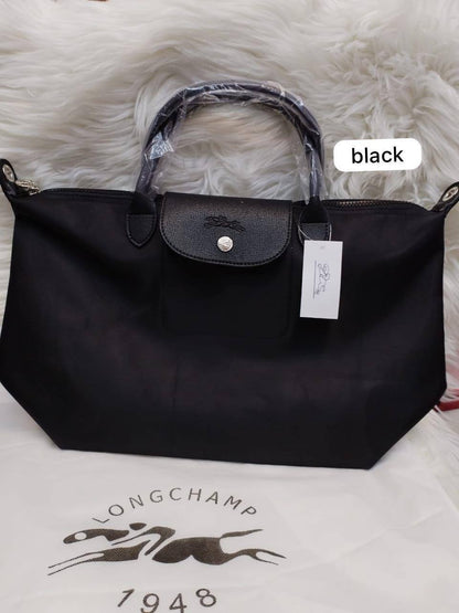 LongChamp 
Hight Quality 
Size: 44*28cm
75 dhs✅

Zain115
♥️♥️♥️