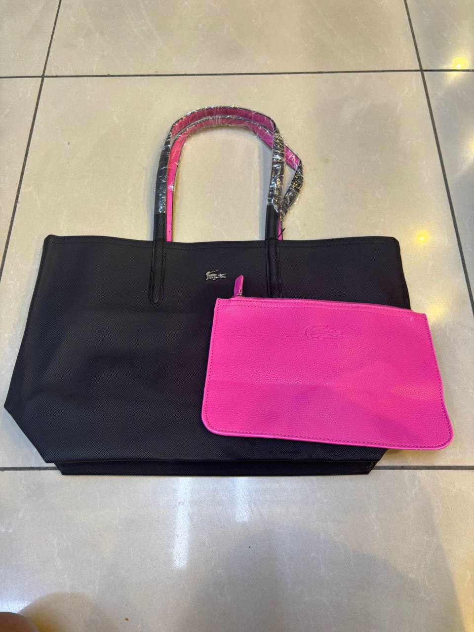 Lacoste
New crocodile double bread, good quality, 

size 46 *30 cm 
70 dhs🪙🖤

Zain12
♥️♥️♥️