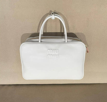 Miu Miu
good quality, 
size 34 *23 cm 
95 dhs✅

Zain12
♥️♥️♥️