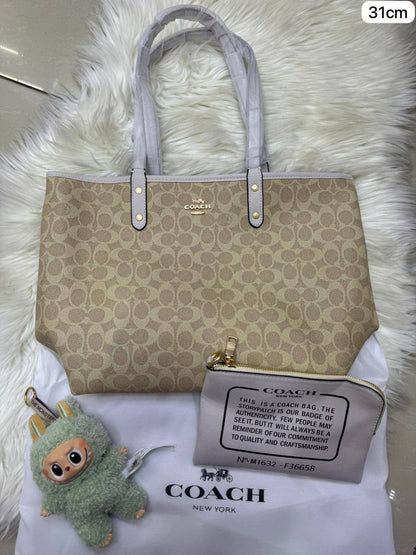 💕 Coach 2 in 1  2️⃣-sided
1️⃣ First quality
Medium Size : 31 * 28 cm
95 dhs✅

Zain115
♥️♥️♥️