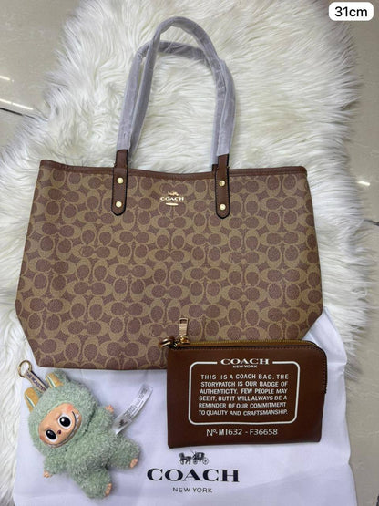 💕 Coach 2 in 1  2️⃣-sided
1️⃣ First quality
Medium Size : 31 * 28 cm
95 dhs✅

Zain115
♥️♥️♥️